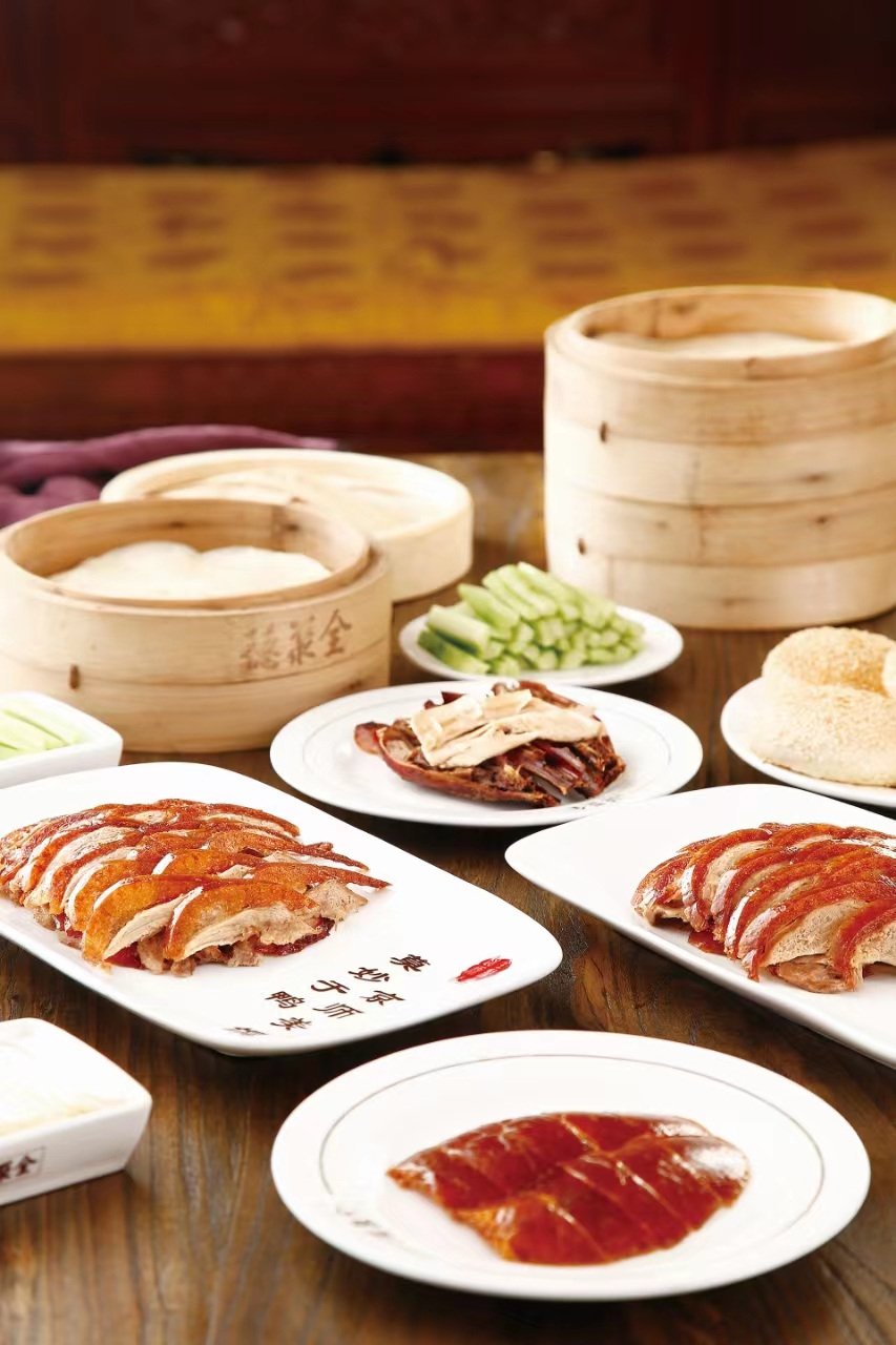 Quanjude roast duck served with pancakes, scallions, cucumber and crisp slices of duck.